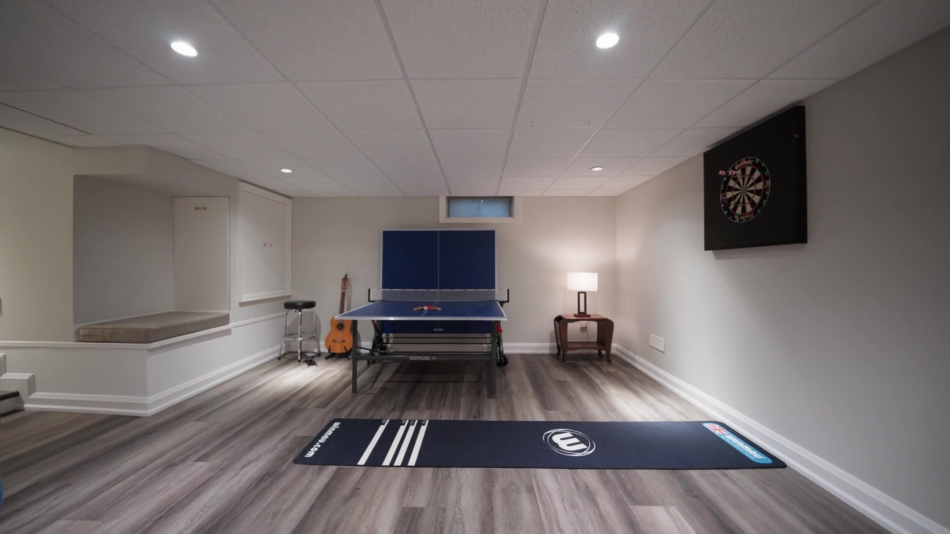 Lower-level games room with table tennis and dartboard