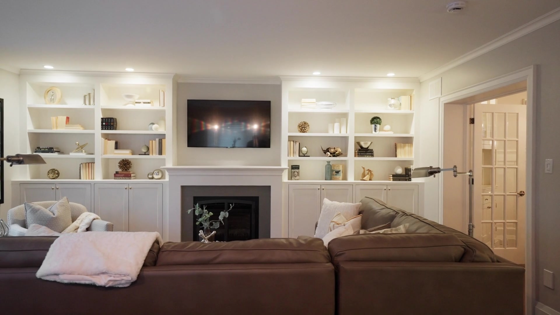 Family room with floor-to-ceiling built-ins and fireplace