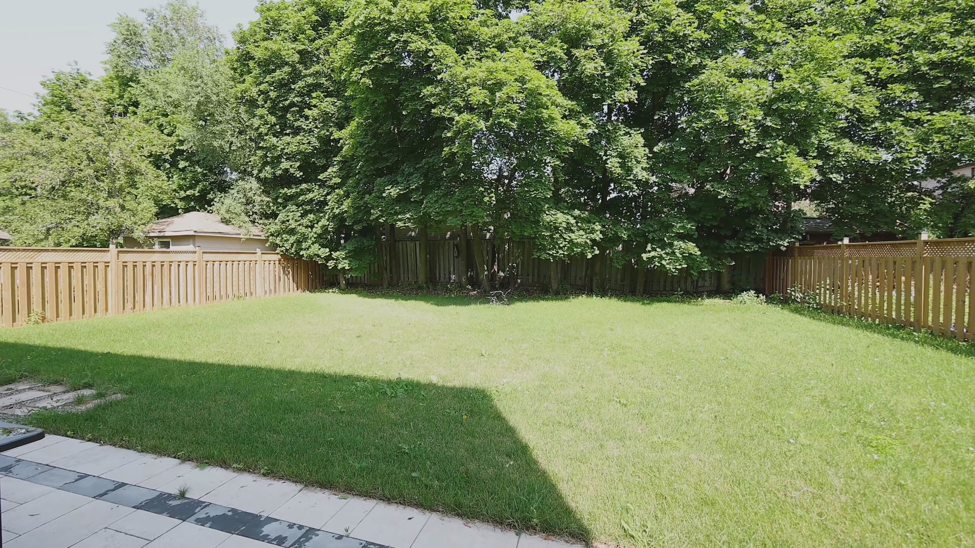 Rear yard with stone patio