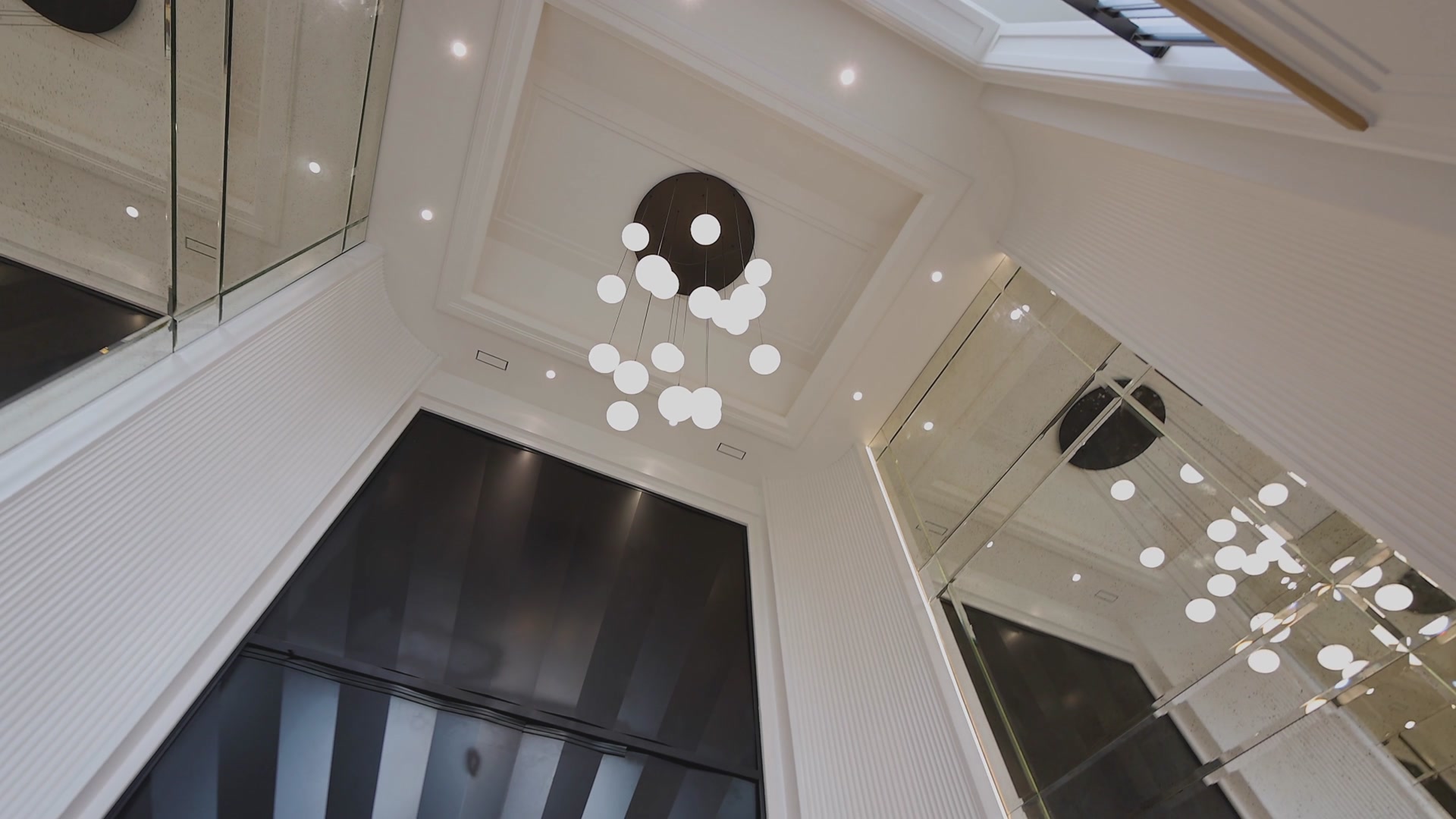 Foyer bubble pendant and mirrored walls