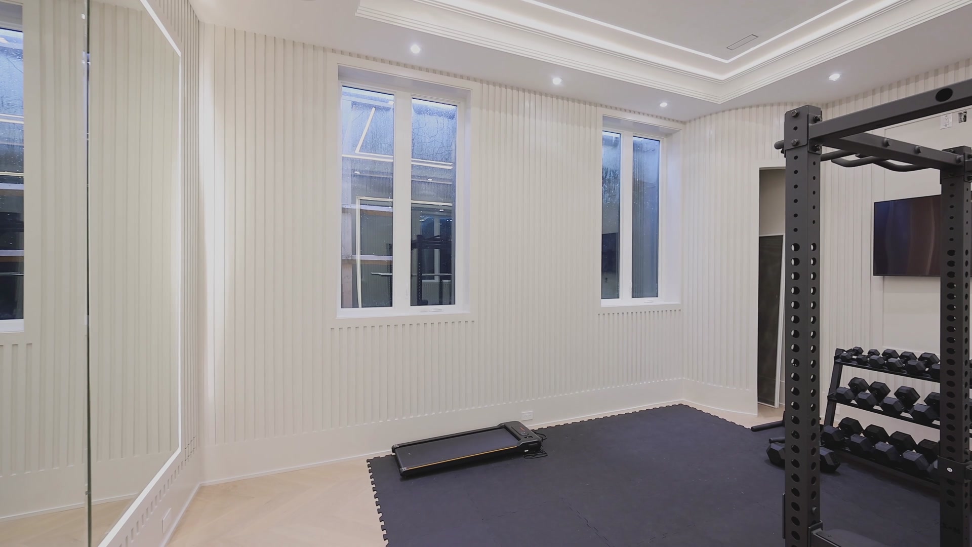 Home gym with vertical-fluted panelling