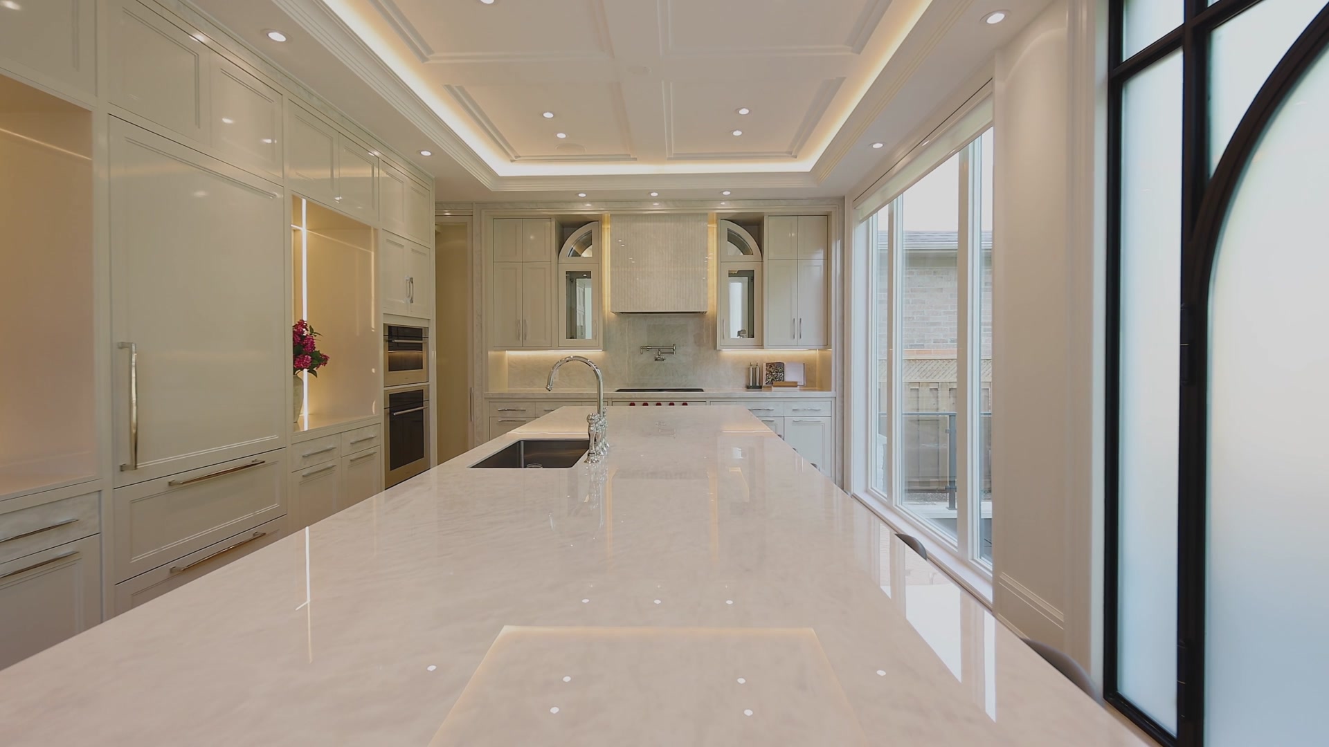 Marble island looking toward the arched steel doors