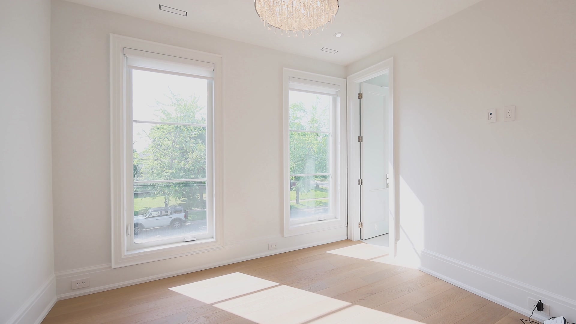 Primary bedroom with bubble chandelier