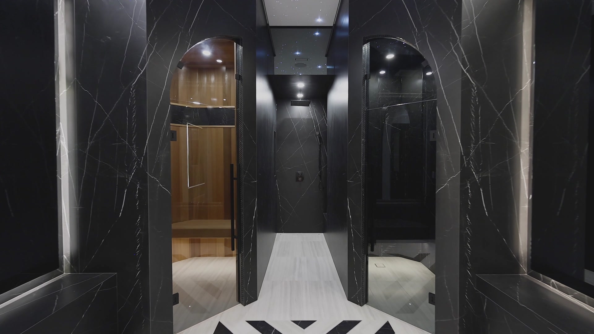 Dark marble wellness suite with sauna and steam
