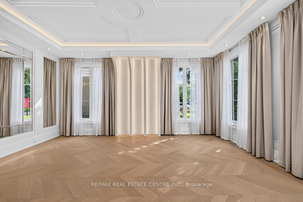 Formal living room with chevron oak and drapery