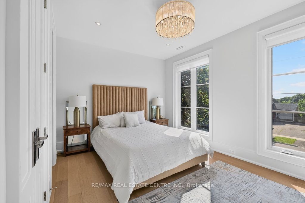 Secondary bedroom with upholstered headboard